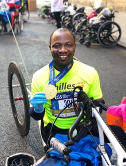 Edmund smiling with his NYC Marathon medal