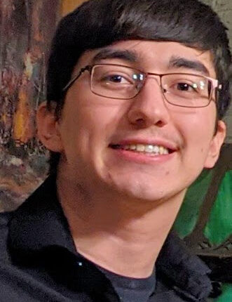 a photo of Cassidy Glascock, a caucasian young man with glasses and short black hair