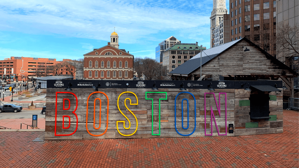 Rainbow letters spelling out "Boston" in the city of Boston